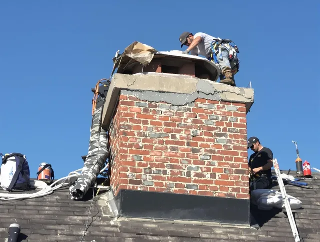 Fountainebleau Chimney Sweep installing a custom chimney crown in Fountainebleau, FL